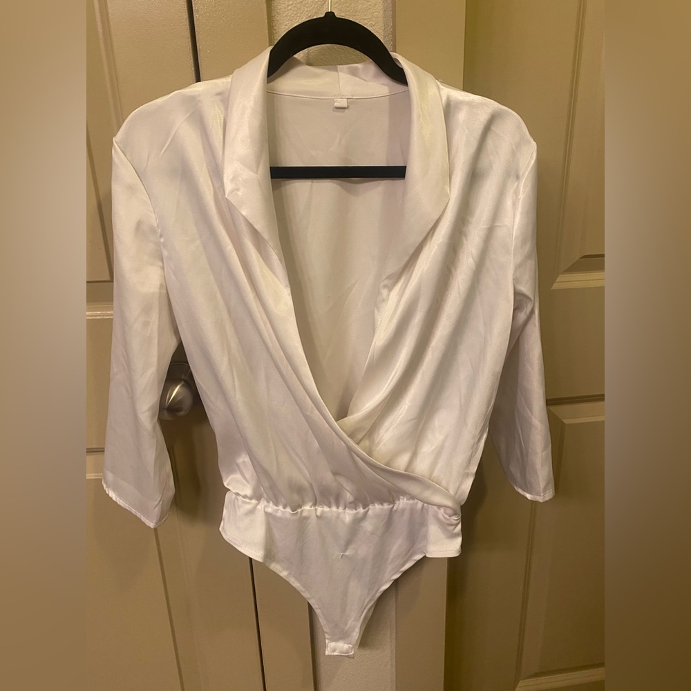 White shiny bodysuit.